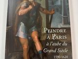 la couverture d'un livre sur laquelle figure le portrait d'un homme tenant un chien dans ses bras