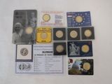 some of the coins and cards are on the table