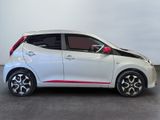 a picture of a white and red car in a room