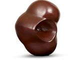 a chocolate sculpture on a white surface with a white background