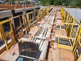 a lot of construction equipment that are on the side of a building