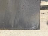 a metal box that is sitting on the sidewalk