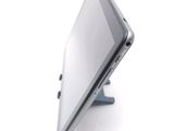 a tablet computer sitting on a stand on a white surface