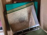 a lot of folders in a box with a map on it