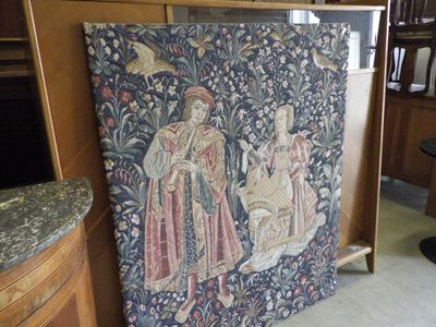 a picture of a tapestry hanging on a wall