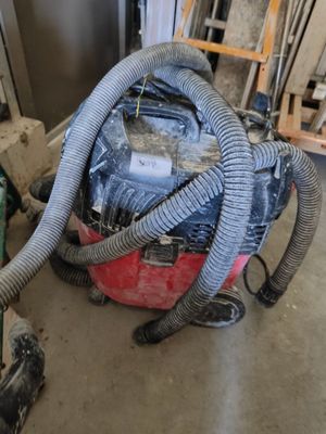 a vacuum that is sitting on the floor in a room