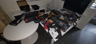 a table with a lot of electronics on top of it