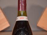 a bottle of wine that is sitting on a table