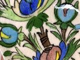 a person holding a cell phone with a floral design on it