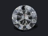 a round brilliant cut diamond on a black background