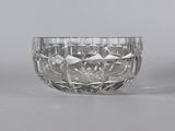 pair of cut glass bowls on a grey background
