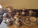 a table that has a lot of silver items on it