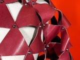 a close up of a mannequin dress made out of red leather