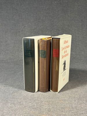 three books that are stacked on top of each other