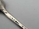 a spoon that has a spoon on it on a table