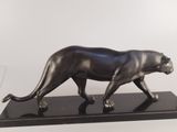 sculpture of a black panther on a black marble base
