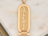 a picture of a gold plated pendant with the word yafer