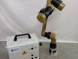 a robot that is standing next to a box