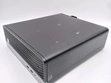 an image of a black computer on a white surface