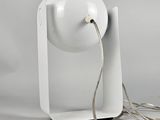 an image of a white table lamp with a cord attached to it