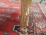 a close up view of a wooden table on a rug