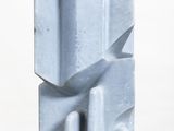 a blue sculpture on a white pedestal with a white background