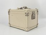 a white suitcase that is sitting on a white surface