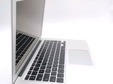 a close up of a laptop computer on a white surface