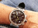 a man that is wearing a watch on his wrist
