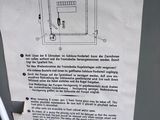 a sign on the side of a refrigerator that has a picture of a cat on it