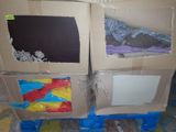 two boxes that have some clothes in them on a pallet