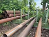 a lot of pipes that are sitting in the dirt
