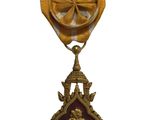 une image représentant une médaille d'or entourée d'un ruban rouge et blanc