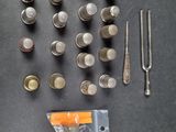 many different types of sewing tools on the table