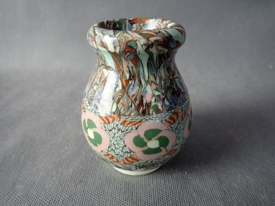 a small vase that is sitting on a table