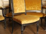 three chairs that are sitting on a wooden floor