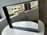 a small table with a mirror on top of it