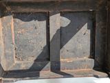 a shadow of a person standing in an old wooden box