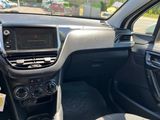 the interior of a car with a dashboard and steering controls