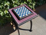 a small table with a chess board on top of it
