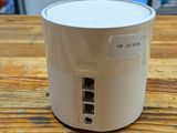 an apple air purifier sitting on top of a wooden table