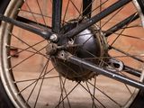 a close up view of a bicycle wheel with a chain