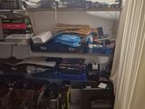 a room with a lot of clutter on the shelves