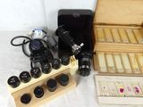 a wooden box with a camera and other items on a table