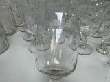 several empty wine glasses are lined up on a table