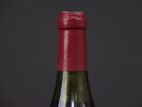 a bottle of wine that is sitting on a table
