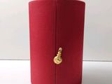 a red box with a gold decoration on it