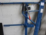 a picture of a blue lift in a garage