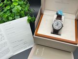 a box with a watch inside of it on a table