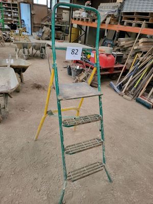 a ladder that is sitting in the middle of a room